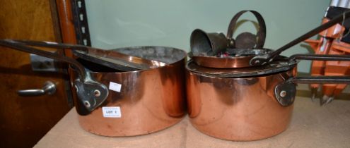 Copper saucepans various, the largest 14cm high, 27.5cm diameter, and a small brass bell