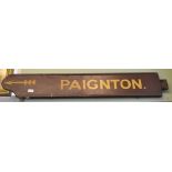 A double sided painted wood inscribed "Paignton" 19 x 113cm cream on brown