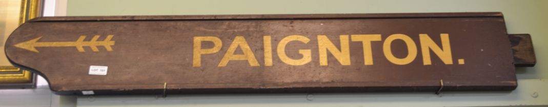 A double sided painted wood inscribed "Paignton" 19 x 113cm cream on brown