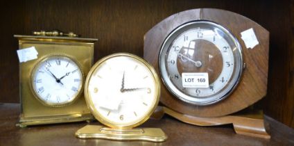 A Newport mantel clock, an Oris mantel clock & another carriage example