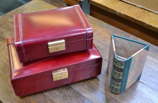 Two unused red leather jewellery boxes by Nina Philipp and a novelty 'book' pen tidy