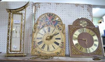 Two hanging skeleton movements, together with a brass clock