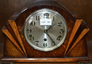 An oak cased Art Deco mantel clock