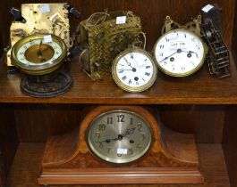 A shelf full of movement & clock parts