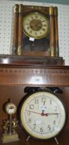 An oversized alarm clock, together with a small brass Estyma clock & another