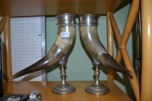 A pair of c.1930's cow horn metal mounted trophies on pedestal bases 33cm high