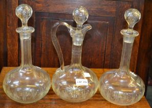 A pair of vintage decanters and stoppers together with the matching claret jug (3)