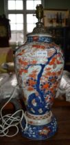 A 19th century Japanese hand painted porcelain vase, cut down to form a lamp