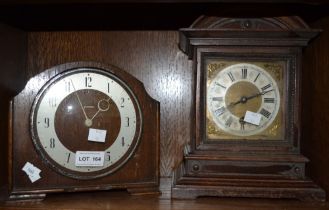 Two oak cased mantel clocks, one made by Ingersoll