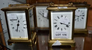 Four brass carriage clocks