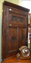 An 18th century oak wall hanging corner cupboard, carved decoration, 100cm high