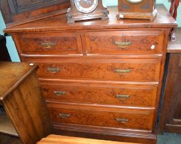 A late Victorian painted pitch pine effect chest of drawers, two over three format, with brass handl