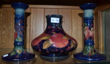 Large Moorcroft pomegranate vase (a/f) and two modern Moorcroft candlesticks