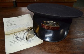 A railway "Guard" cap with "TR" and Prince of Wales crest with a LNER whistle and other