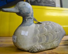 A carved wooden decoy duck