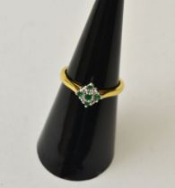 An 18ct gold, diamond and emerald set ring, gross weight 2.7g. ring size L