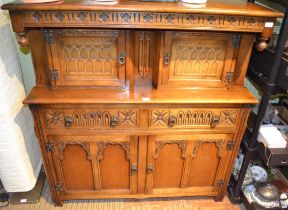 Old Charm oak finished carved front court cupboard