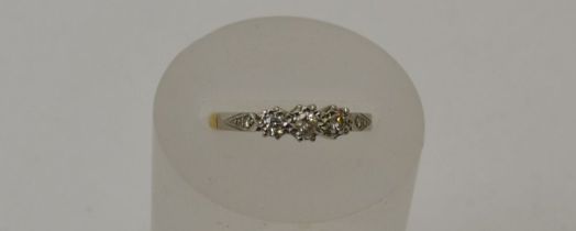 An 18ct gold, three stone diamond ring, gross weight 3.1g, ring size N1/2