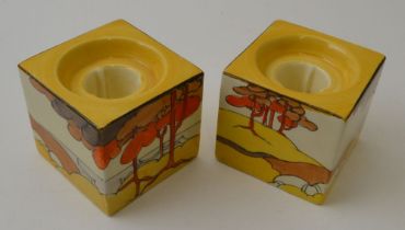 A pair of Clarice Cliff Coral Firs pattern, hand painted pottery cube form candle holders, pattern n