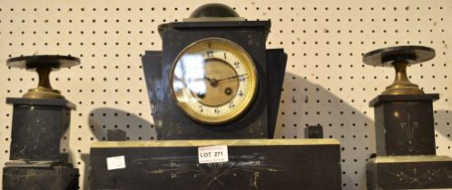 A Victorian black slate clock garniture