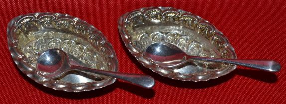 A pair of small boat shaped silver salts with silver plated spoons, 1903