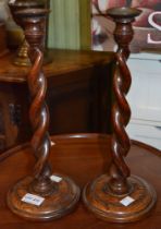 Pair of oak barley twist candlesticks