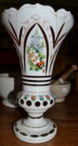 A late 19th century Bohemian white cased pink glass vase, with cut Gothic panels, hand painted with