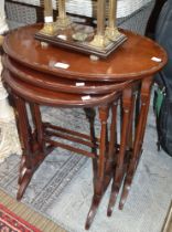 A nest of three mahogany oval tables