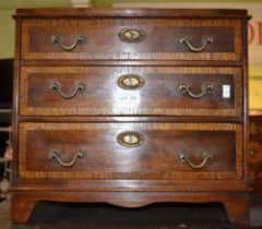 A three drawer table top chest