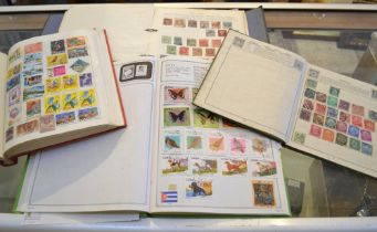 four albums of mixed world stamps