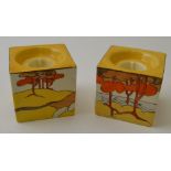 A pair of Clarice Cliff Coral Firs pattern hand painted pottery cube form candle holders, pattern nu