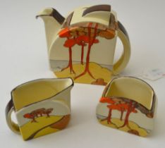 A Clarice Cliff Coral Firs pattern three piece pottery tea set, classic Art Deco design from the 193