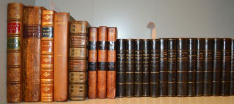A collection of half calf leather bindings includes six volumes of the Universal history published i