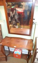 Small mahogany table with under tier and a modern framed mirror