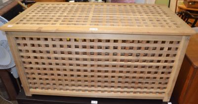 A wooden trellis built box coffer