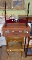 Gold bedside unit a suitcase and a sword rack !