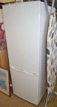 A white finished slender free-standing fridge freezer