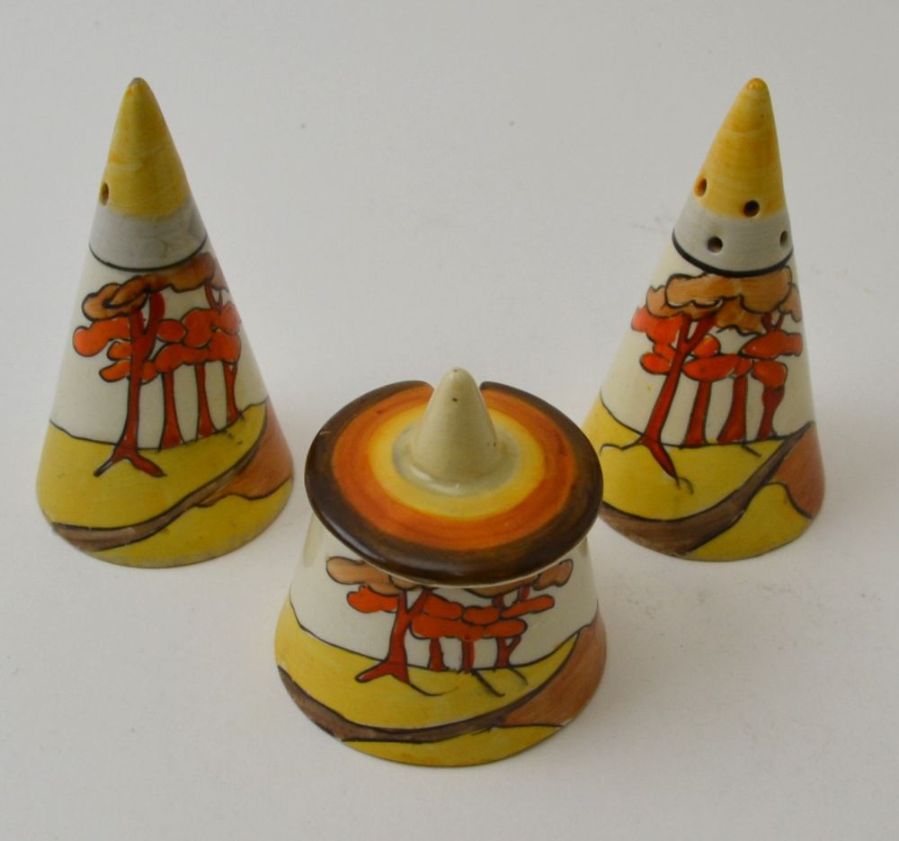 A Clarice Cliff Coral Firs pattern, hand painted pottery three piece condiment set, comprising conic