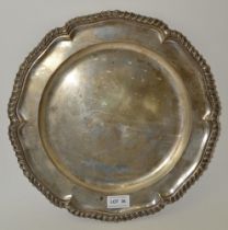 A Continental circular silver salver, with gadrooned rim, bears various hallmarks and the word "SING