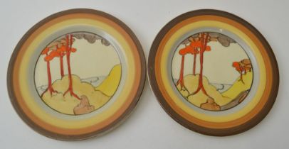 A pair of Clarice Cliff Coral Firs pattern, circular hand painted pottery tea plates, 15cm diameter,