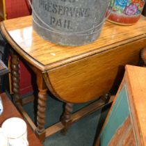 A light oak twin flap barley twist gate leg table