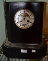 A large black slate mantel clock