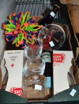 A small box containing drinks glasses Babycham etc