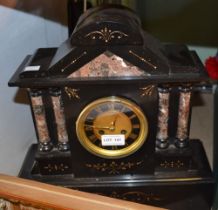 A black slate and marble mantel clock