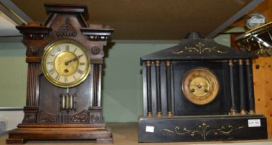 A black slate mantel clock plus another wooden example