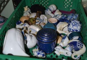 A plastic tray of small porcelain and china collectibles