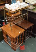 Two nests of tables with a vintage magazine rack