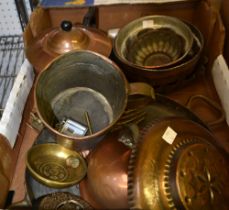 A box containing a selection of brass and copper wares to include jelly moulds etc