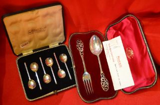 A cased silver Christening set & spoons