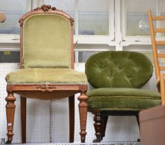 A late Victorian button back nursing chair together with a carved oak framed single chair